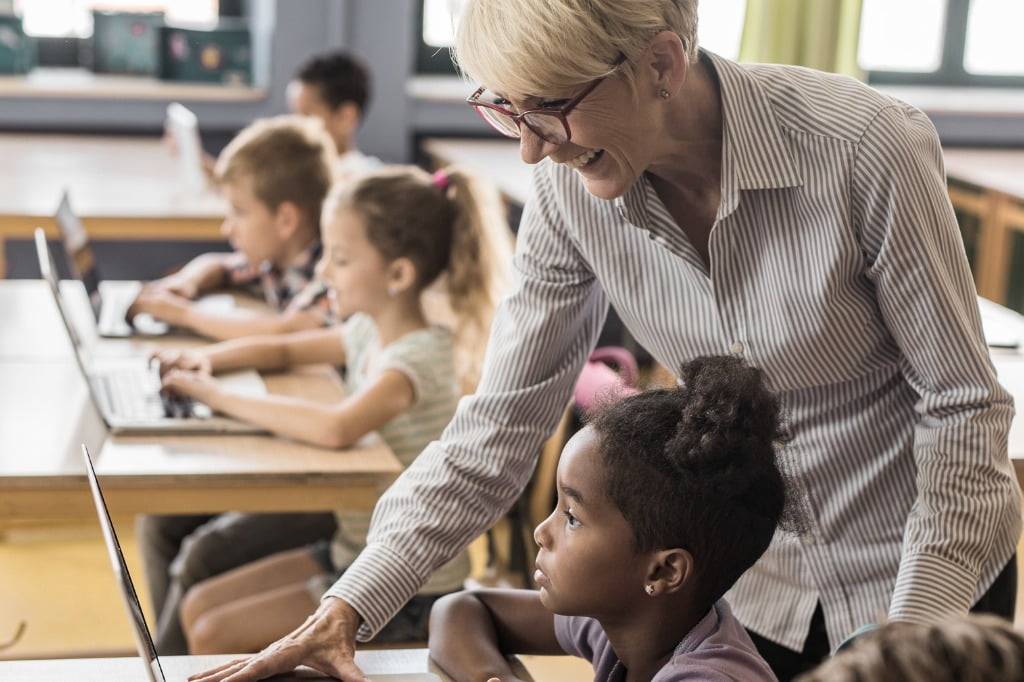Teacher Helping Student with Google Classroom Worksheet - TeacherMade