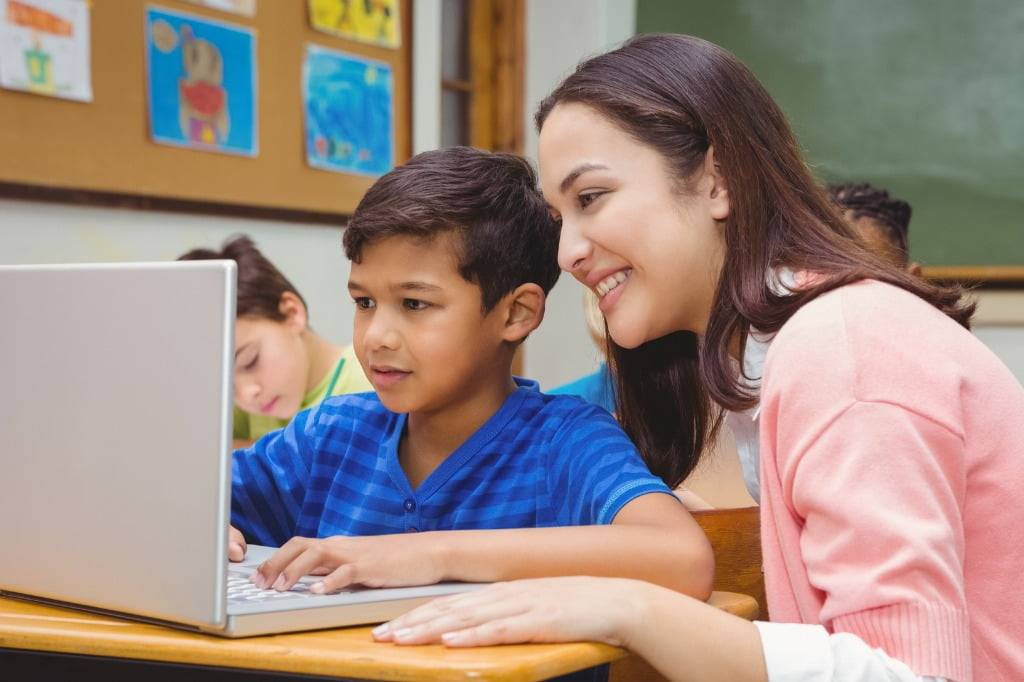 Teacher Working with Student on TeacherMade Homework App